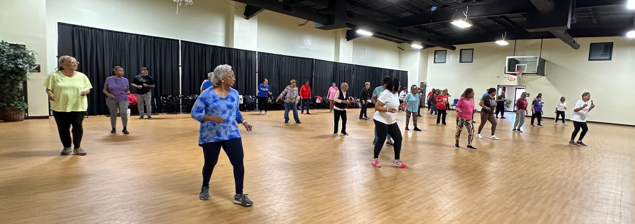 OLLI members moving together in a fitness class